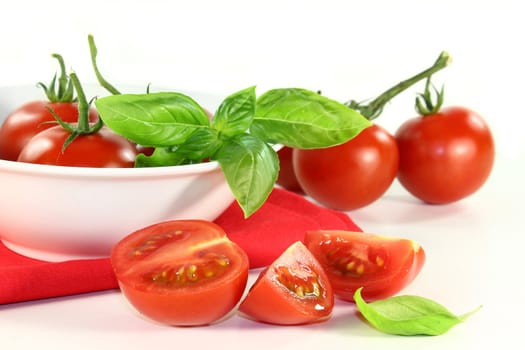 fresh red tomatoes in a white bowl