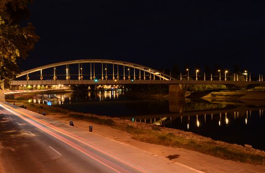 Long exposure night shot of the Belvárosi híd (Downtown Bridge) in Szeged, above the river Tisza.
