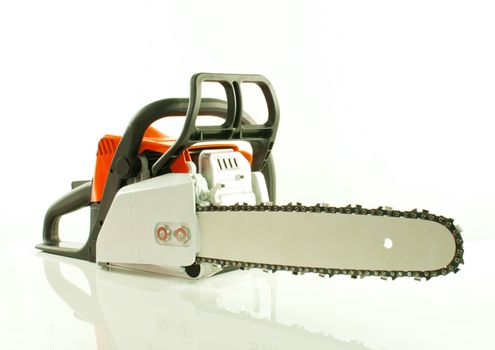 Chainsaw over the white background