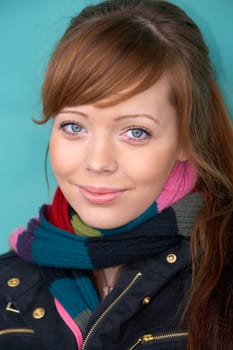 Teenage girl portrait, wearing scarf, smiling