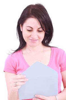 Young beautiful woman opening a letter isolated on a white background