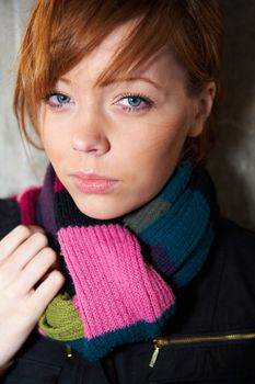 Teenage girl portrait, wearing scarf, looking at camera