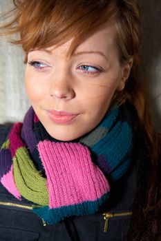 Teenage girl portrait, wearing scarf, looking away