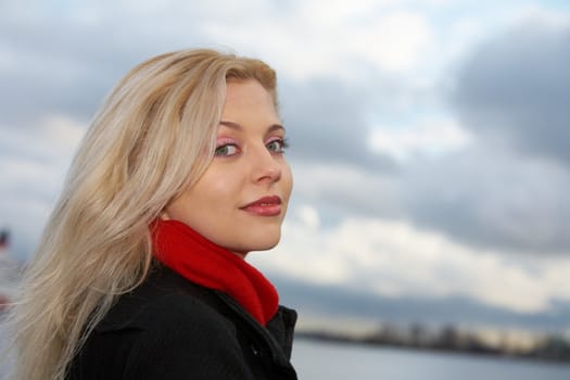 Young woman looking at camera outdoors