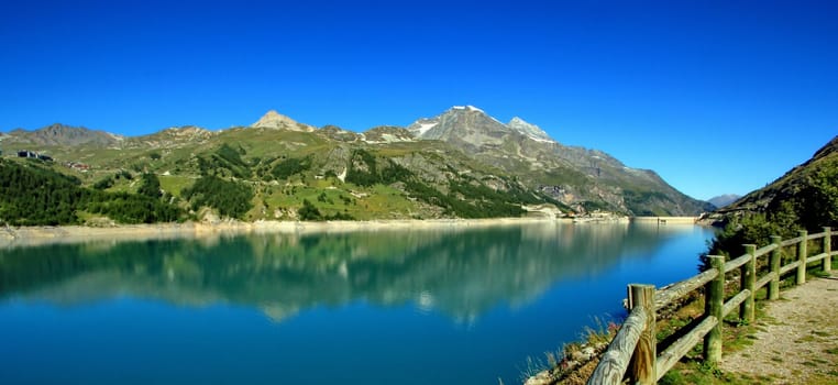 Panoramic view on Chevril lake, dam and Tignes village in the Alps mountain, France
