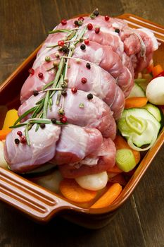 roast of beef with fresh vegetables ready to cook