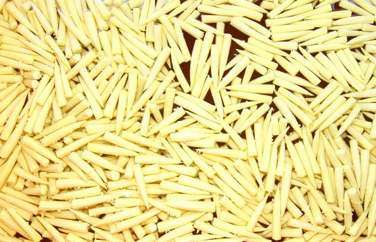 Baby corn cobs arranged as a background