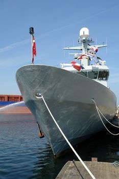 Navy warship frigate anchored in a base port