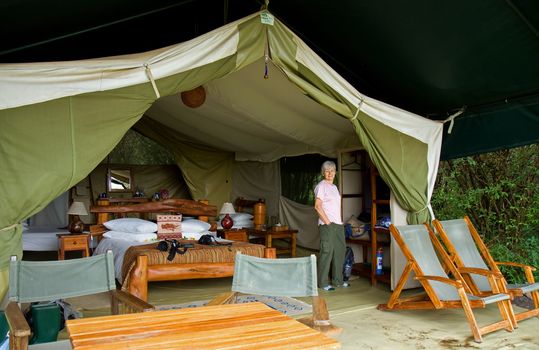 Woman in luxury safari tent in Kenya