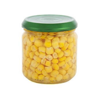 Glass jar of sweet corn with green lid on white background