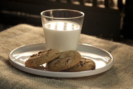 Three cookies and a glass of milk set out on Christmas Eve for Santa Claus