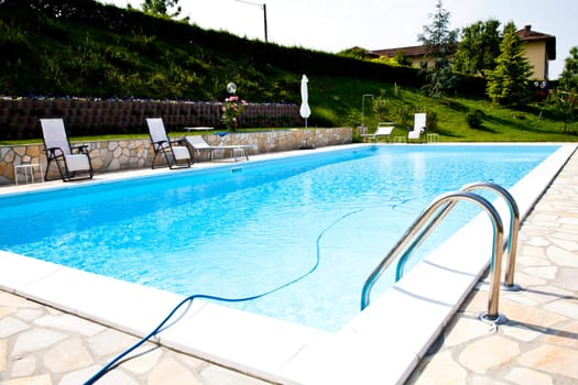 Swimming pool of an Italian beauty farm in the middle vineyards, Monferrato area, Piemonte region.