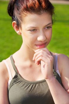 Teenage girl contemplating outdoors