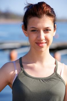 Portrait of teenage girl outdoors, smiling