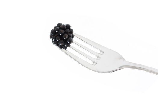 Blackberries on a fork ready to eat