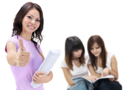 Female student thumbs up with great smile.