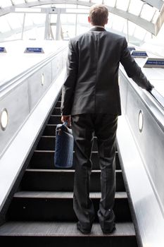 A business man commuting in  suit