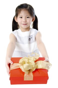 Little Asian girl arms out holding a beautiful wrapped present. Focus is on the ribbons.