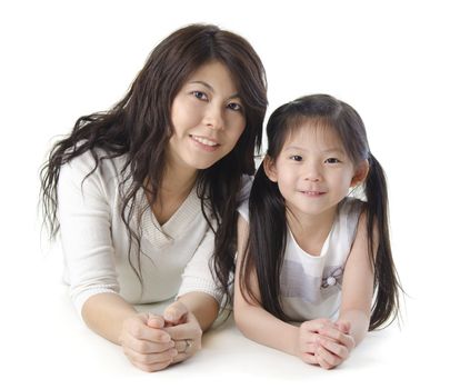 Asian mother and her daughter on white background