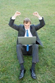 Business man sitting in the park