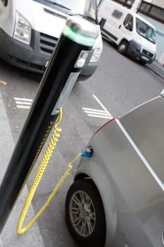 An electronic car chargingin the city