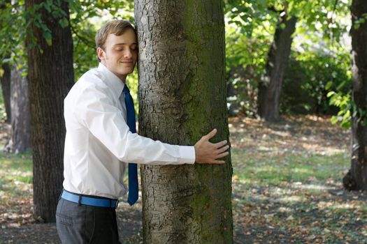 A man hugging a tree