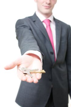 A business man giving you the keys to a home