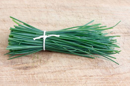 Chives on a wooden surface