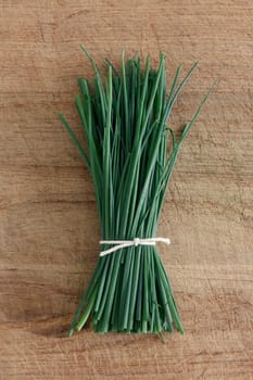 Chives on a wooden surface