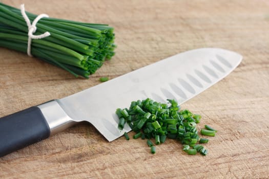 Chives on a wooden surface