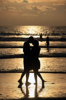 Couple on sunset. Coast of the Indian ocean