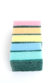 Colourful sponges isolated on a white bg