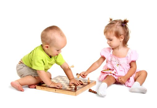 Children playing chess on the white background
