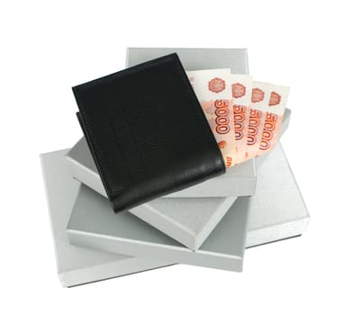 Wallet with Russian banknotes on silver gift boxes