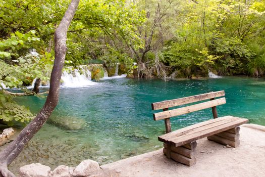 Wooden bench in Plitvice lake - Croatia.