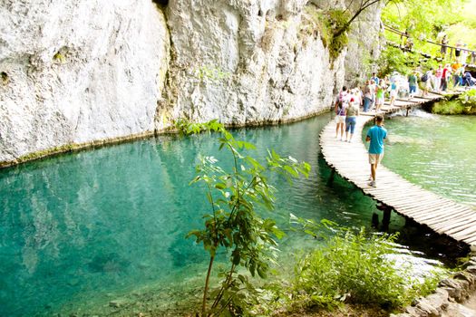 Croatia, wooden path on beauty blue lake, Plitvicka Lake. National Park.