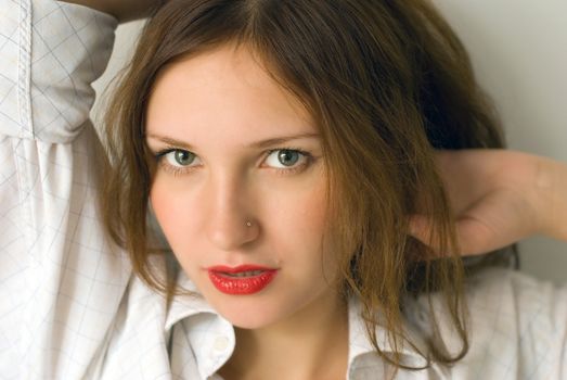 Portrait of beautiful young woman with red lipstick