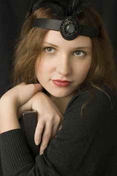 Retro portrait of beautiful young woman in black