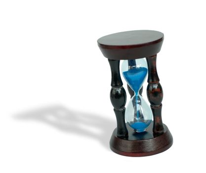 Hourglass with blue sand on white background