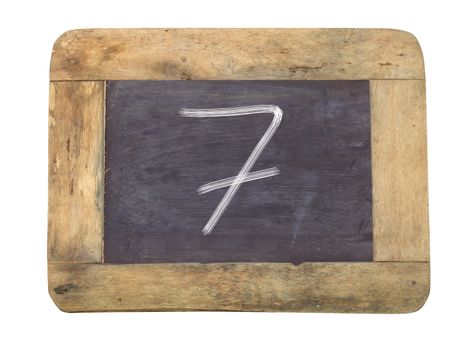 The number "7" written with white   on a blackboard