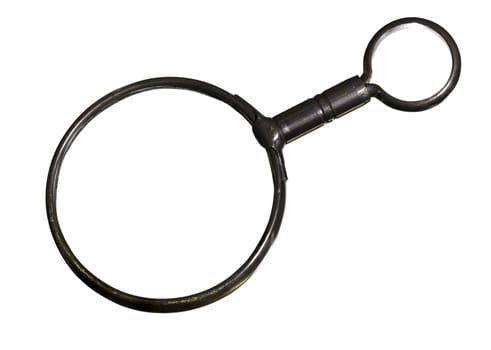 Clipping path around antique brass magnifying glass isolated against white