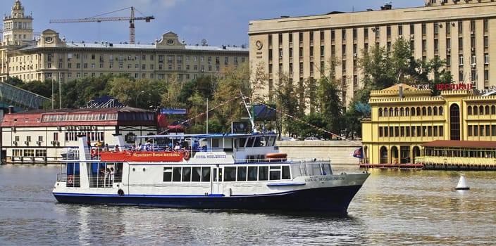 pleasure boat on the river, outside the urban landscape, the day