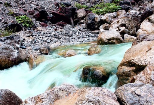 fast clear mountain river between big stones