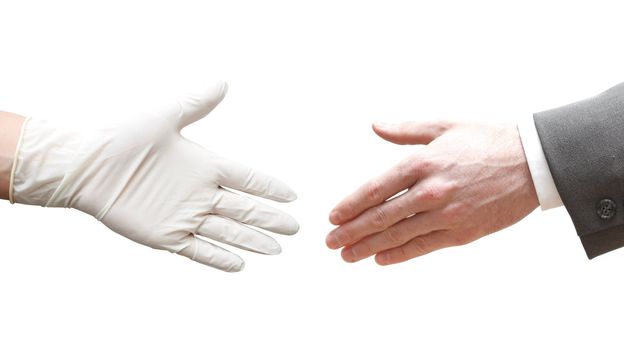 A doctor shaking hands with a business man