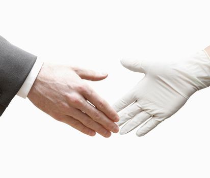 A doctor shaking hands with a business man