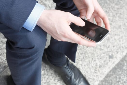 Businessman texting