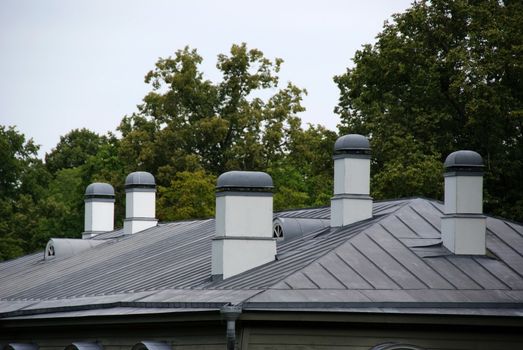 Chimneys are constructed on a metal roof