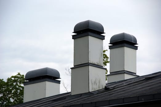 Chimneys are constructed on a metal roof