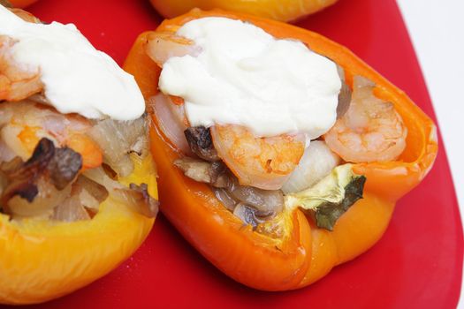 Peppers stuffed with shrimps, mushrooms and onion