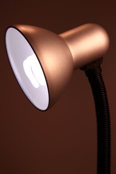 a table lamp on the red background